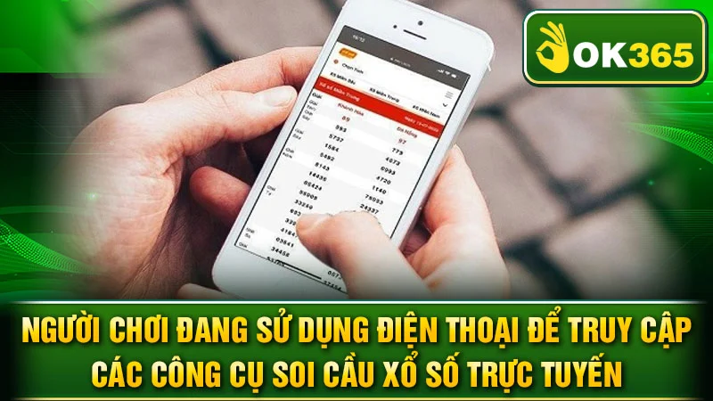 Người chơi đang sử dụng điện thoại để truy cập các công cụ soi cầu xổ số trực tuyến.